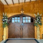 The restored handcrafted one-of-a-kind barn doors open to reveal your indoor event.